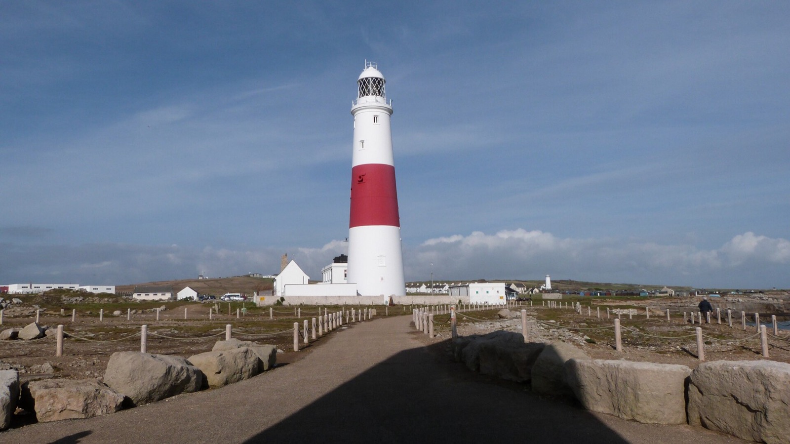 Portland Bill lighthouse, red and white, on the tip of the Isle of Portland