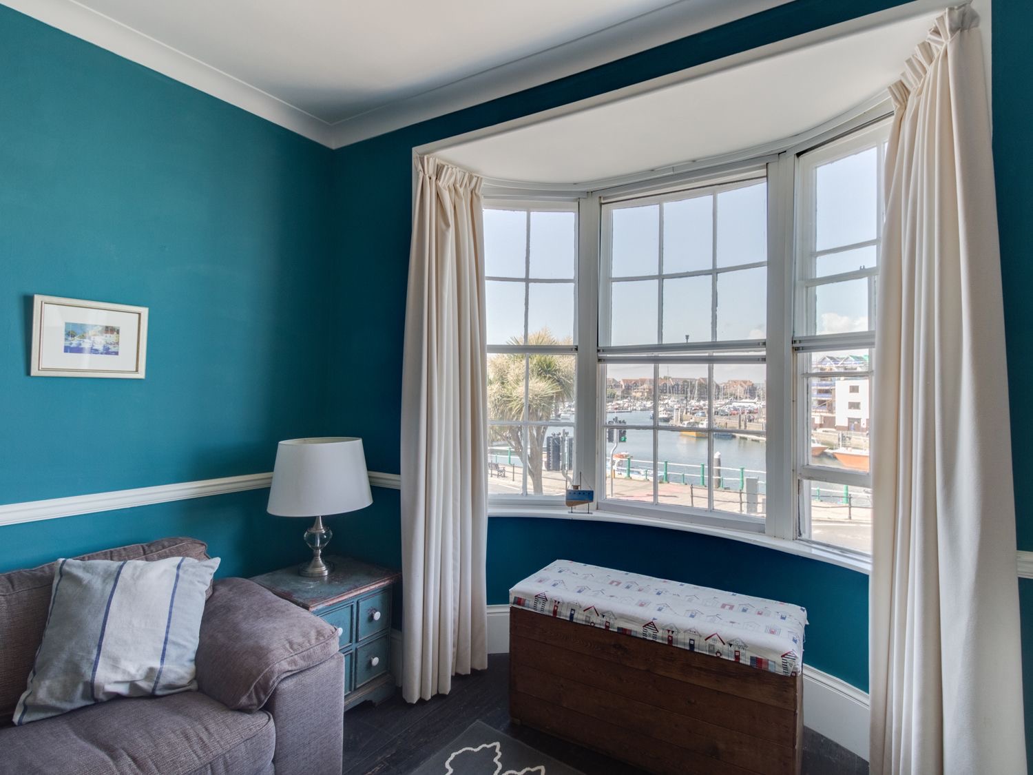 Sailor's Watch sitting room: a deep bay window looking straight over Weymouth's inner harbour