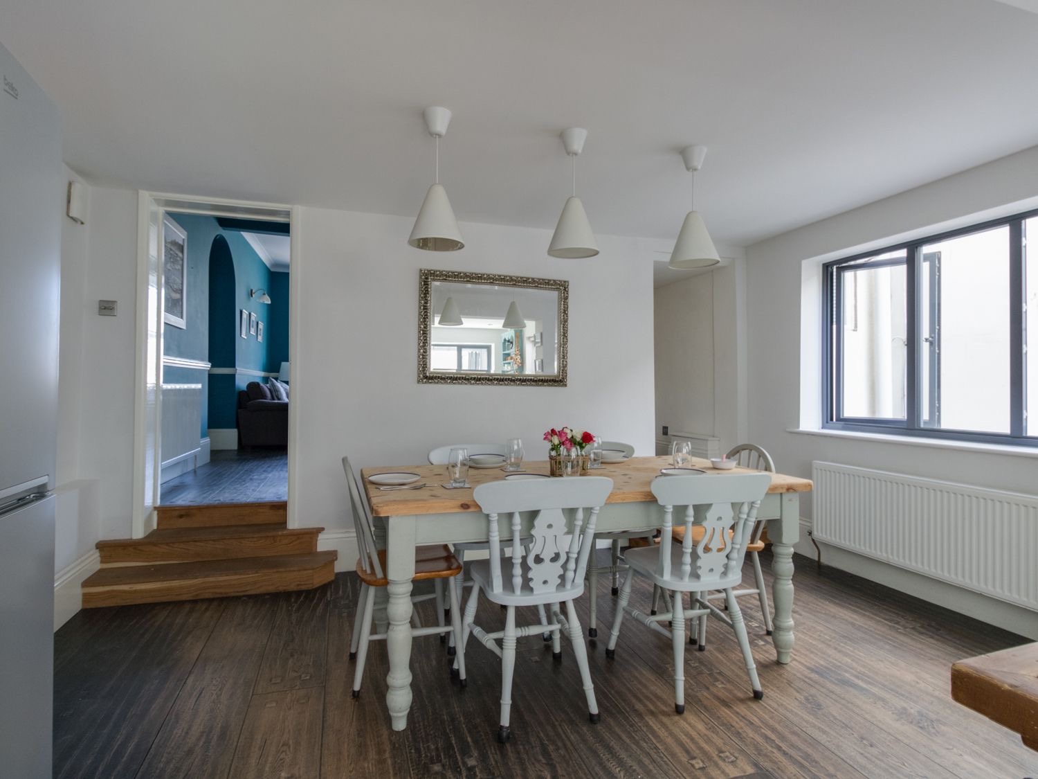 Dining table for six under pendant lights at Sailor's Watch