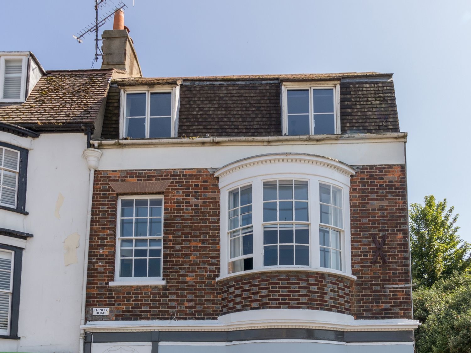 The brick and white-rendered house on Trinity Road that contains Sailor's Watch