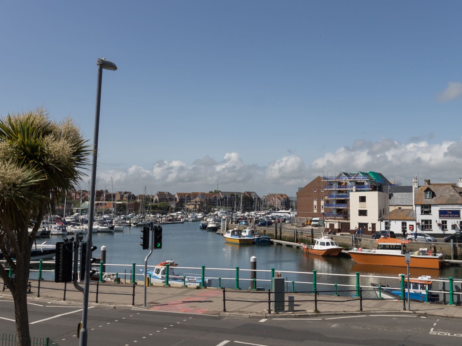 Weymouth inner harbour from Trinity Road with yachts and the town beyond
